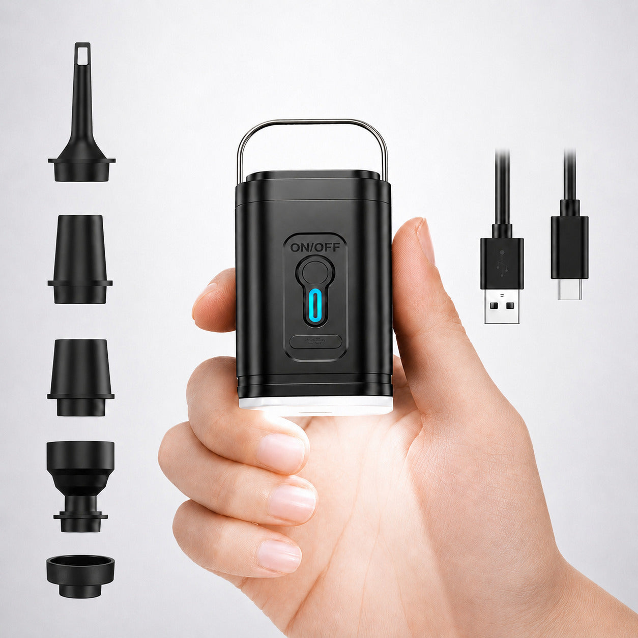 Aervira Rechargeable Mini Compression Pump shown in hand with five nozzle attachments and USB charging cable