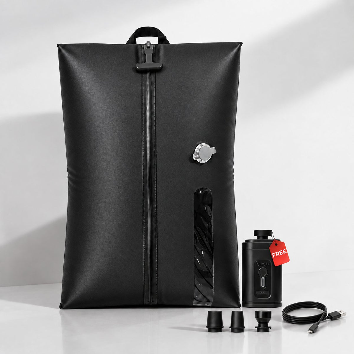 Aervira black travel vacuum compression bag with a rechargeable mini pump, three nozzle adapters and a USB-C charging cable.